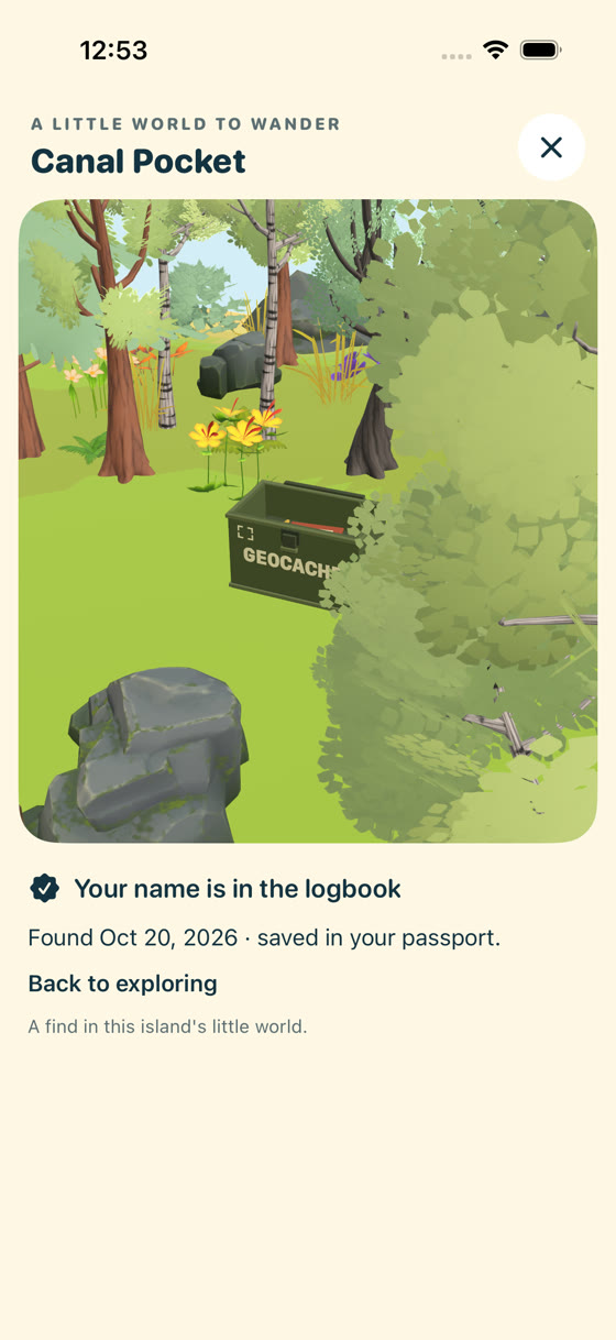 A small olive geocache can sits in the island scenery, with an option to sign its tiny logbook.
